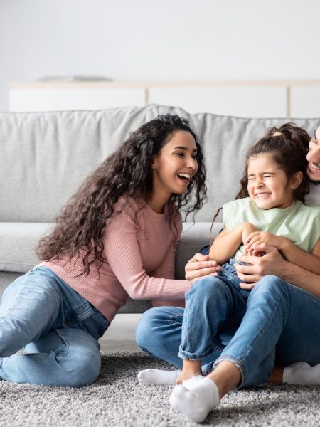 Middle,Eastern,Parents,Having,Fun,With,Their,Little,Daughter,At